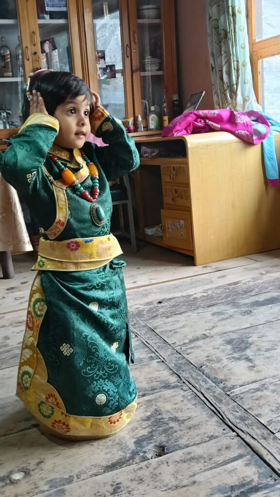 Trekking in Nepal with kids Big Sky Treks beautiful kid in gurung dress